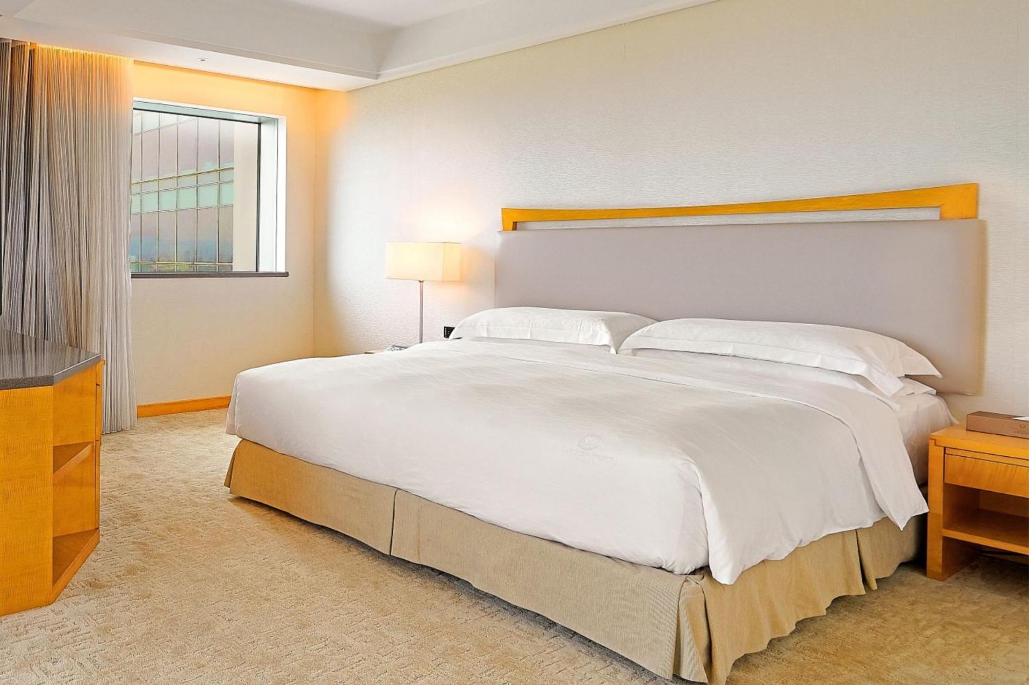 Windsor Hotel Tajcshung Szoba fotó A bedroom at the hotel